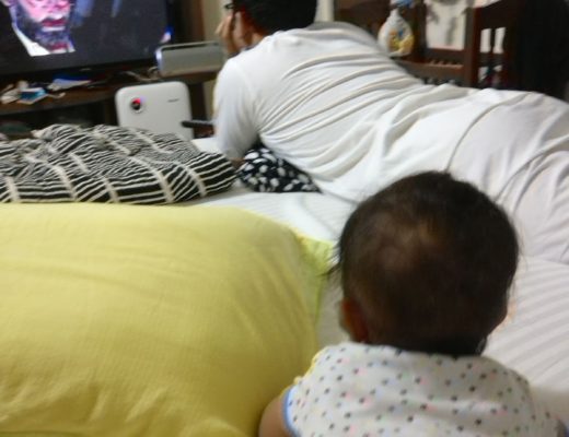 Father and baby watching TV