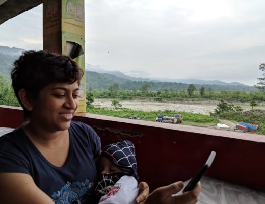 mother with baby on phone