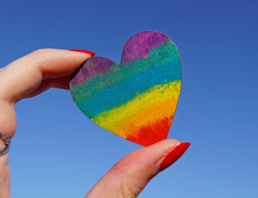photo-of-person-holding-multicolored-heart-decor