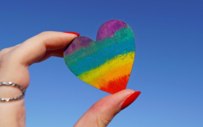 photo-of-person-holding-multicolored-heart-decor